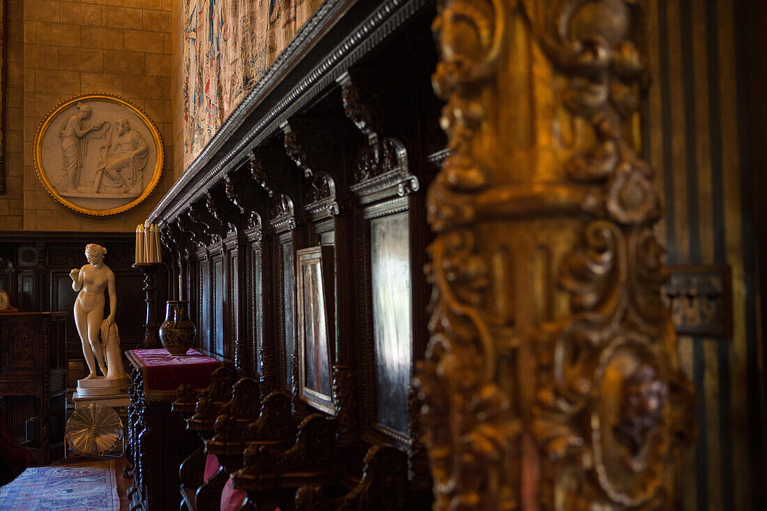 Hearst Castle interior walls are decorated with choir chair stalls,statues,and ornate decoration.,Hearst Castle,San Simeon,California