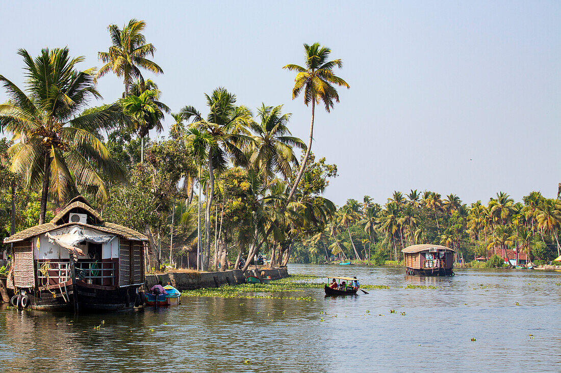 Traditional rice barges converted into tourist boats on the backwaters of Kerala,India,Kerala,India