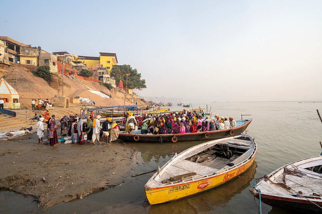 Pilgrims in a boat on the bank of the Ganges River,Uttar Pradesh,India,Varanasi,Uttar Pradesh,India