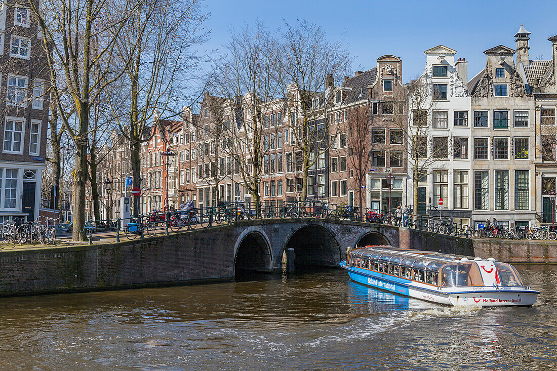 Tourist canal boat cruise,Herengracht,in Amsterdam,Amsterdam,North Holland,Netherlands