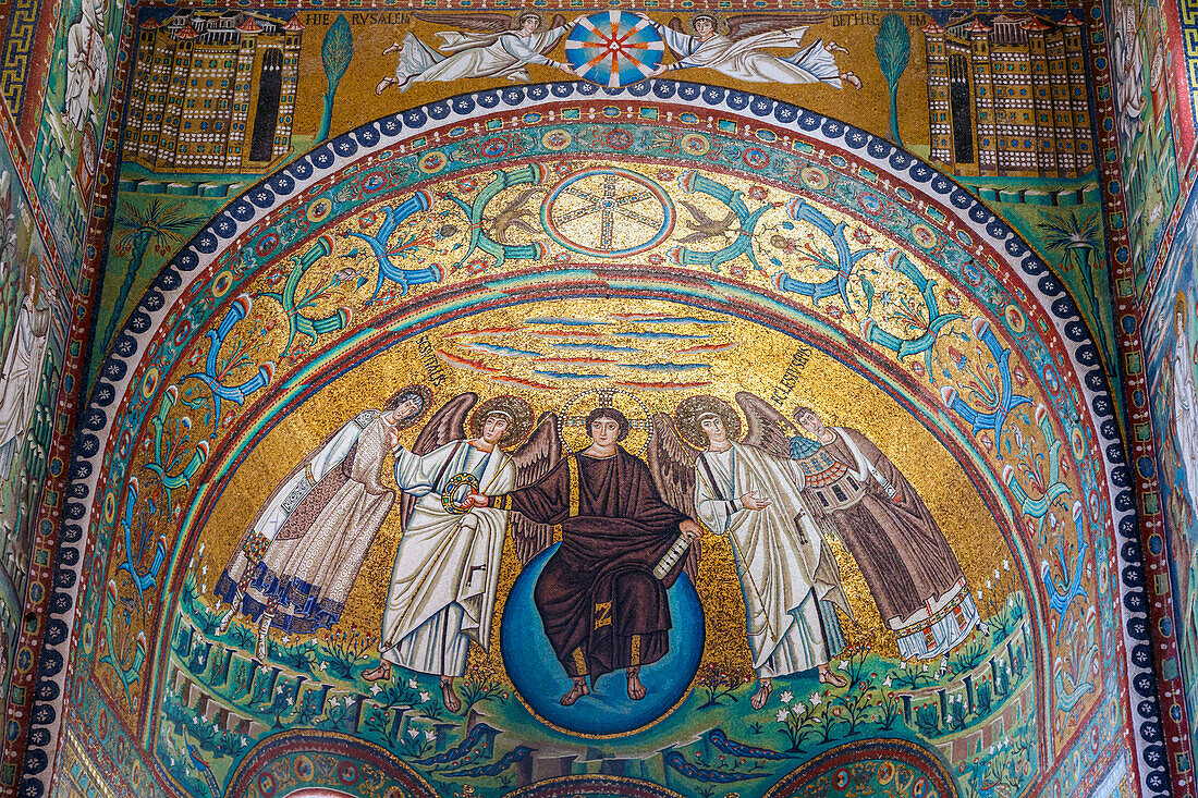 Ravenna,Ravenna Province,Italy.  Mosaic in apse of Basilica di San Vitale of Christ flanked by two angels and St. Vitalis and Bishop Ecclesius.  Christ is handing the Crown of martyrdom to St. Vitalis.  The early Christian monuments of Ravenna are a UNESCO World Heritage Site.