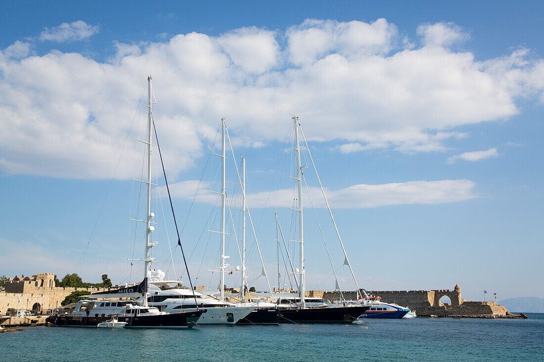 Yachts moored in Kolona Harbour in the medieval city of Rhodes,Greece,Rhodes,Dodecanese,Greece