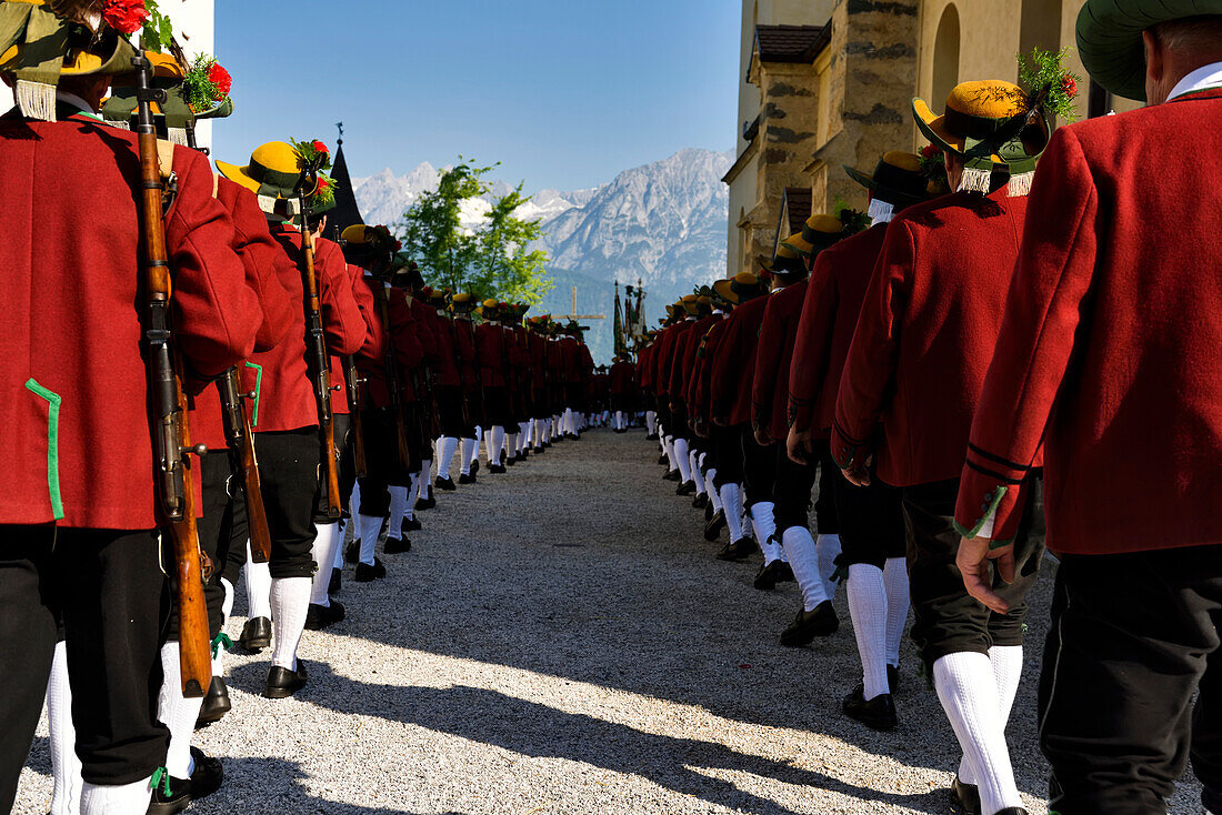 Lining up outside the Mary Immaculate parish church in Weerberg village,local people in traditional clothing,celebrate Herz-Jesu with a procession.,Austria.