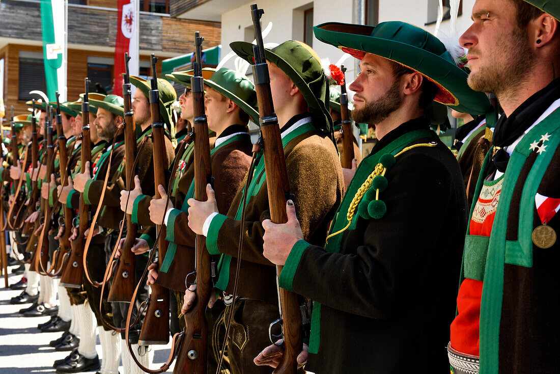 Lining up outside the Mary Immaculate parish church in Weerberg village,riflemen in traditional clothing,celebrate Herz-Jesu.,Austria.