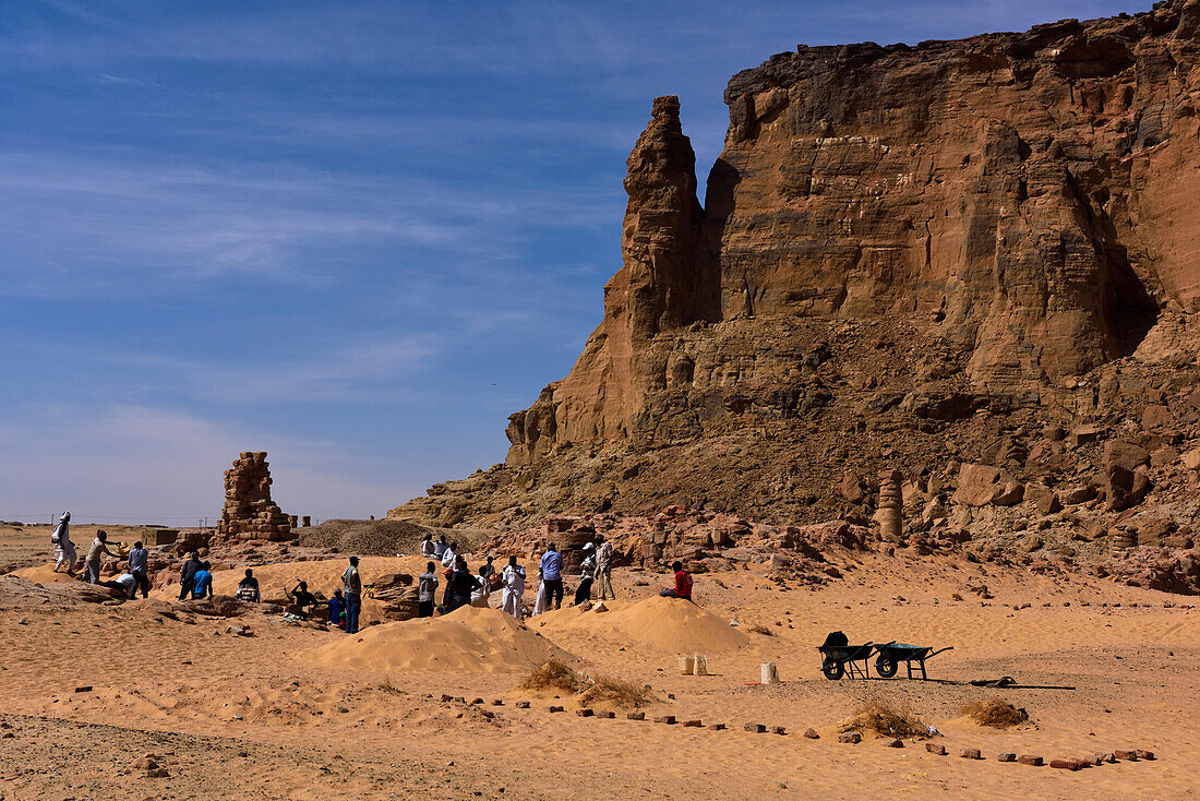 Sudanese workers at the temple of Amun,at the foot of Jebel Barkal plateau.,Meroe,Sudan,Africa.