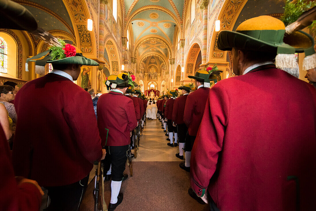 Inside the Mary Immaculate parish church in Weerberg village,local people celebrate Herz-Jesu with a Color Guard procession.,Austria.