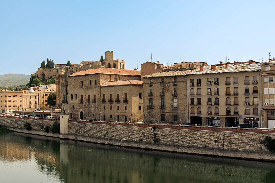 View of the riverbank of Ebro River and Castle of Sant Joan in the background,Tortosa,Spain,Tortosa,Tarragona,Spain