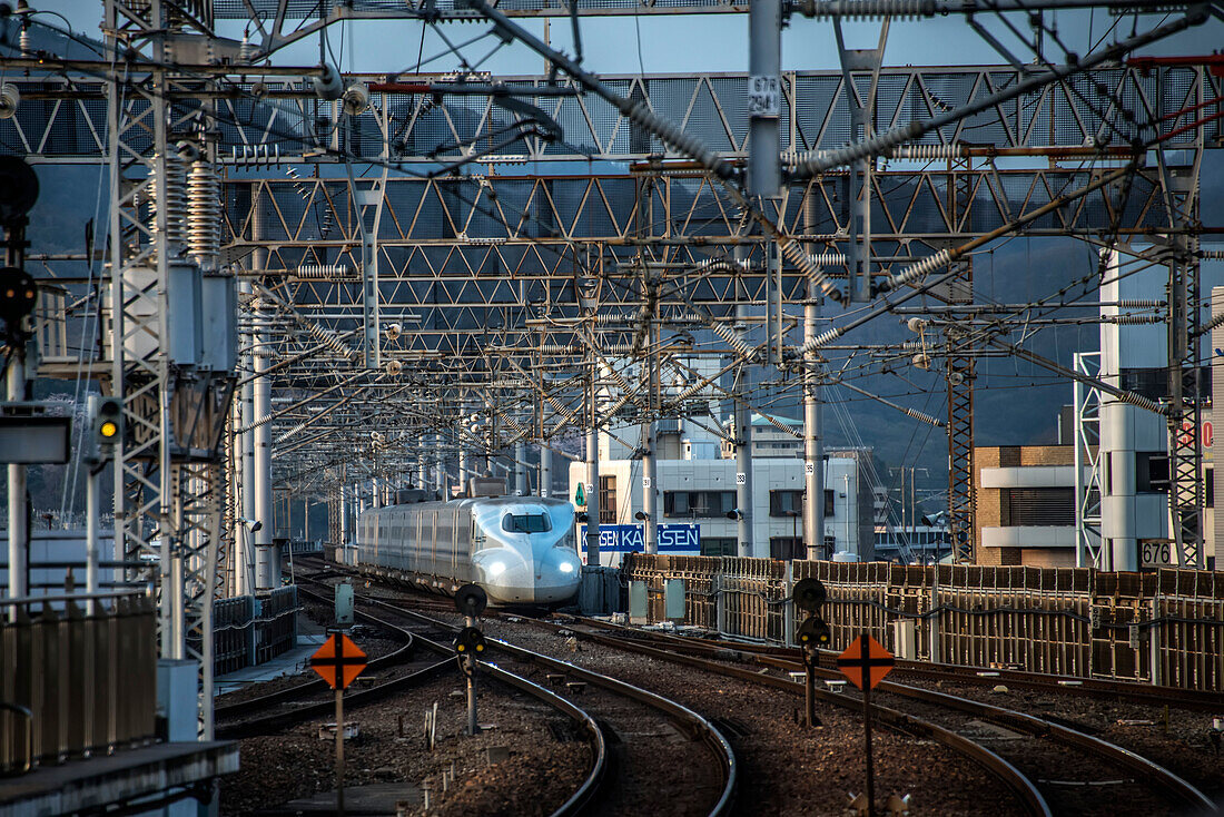 Japanese Shinkansen,or Bullet train,pulling into the station in Okuyama,Japan.  The high speed trains connect most major Japanese cities and can operate up to 200 miles per hour,Okuyama,Japan