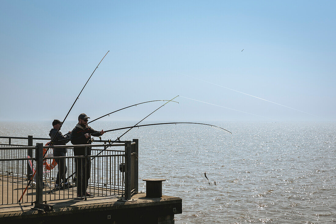 Fishermen at Southwold pier,Suffolk,UK,Southwold,Suffolk,England