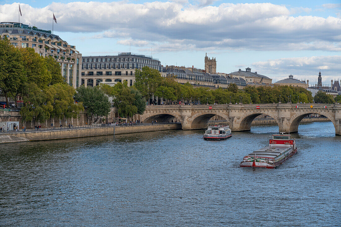 Boats sailing down the Seine River in Paris,France,Paris,France