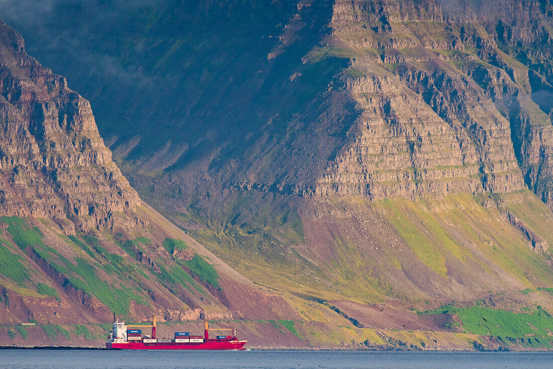 Container ship leaving the port of Isafjorour on the north coast of Iceland,Iceland