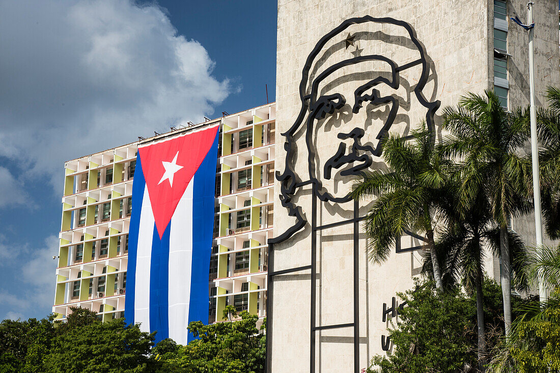 Revolutionary Square with the Cuban flag and an image of Che Guevara on a government building,Havana,Cuba