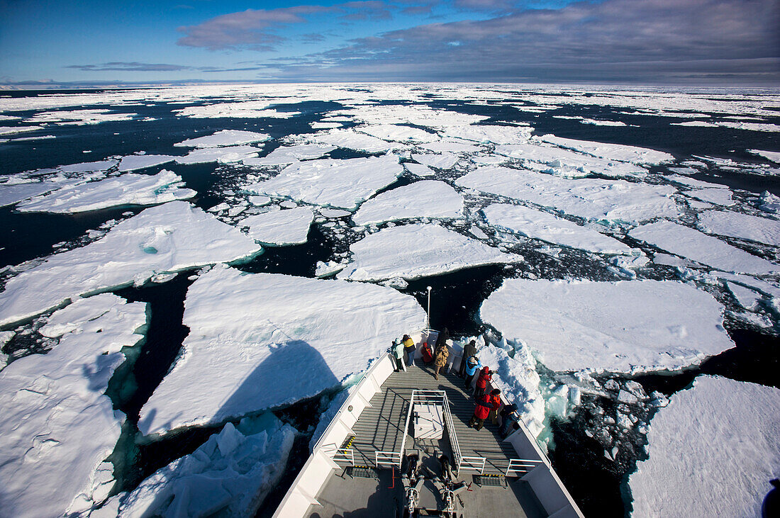 Cruise ship slides through broken up ice,Storfjorden,Norway