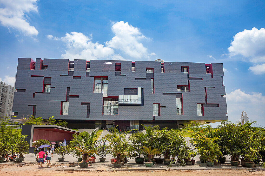 Looking like a massive cube puzzle,the Guangdong Museum sits next to the Guangzhou Opera House in Guangzhou,Guangdong province,People's Republic of China. Rocco Yim is the Hong Kong architect who designed the museum,Guangzhou,Guangdong province,China