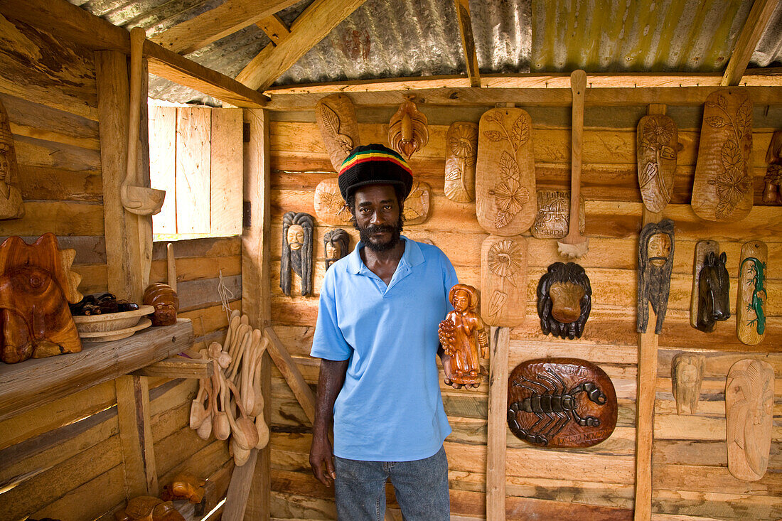 Wood carver stands inside his studio in Jamaica,Bluefields Bay,Jamaica