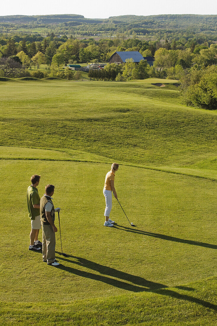 People Golfing