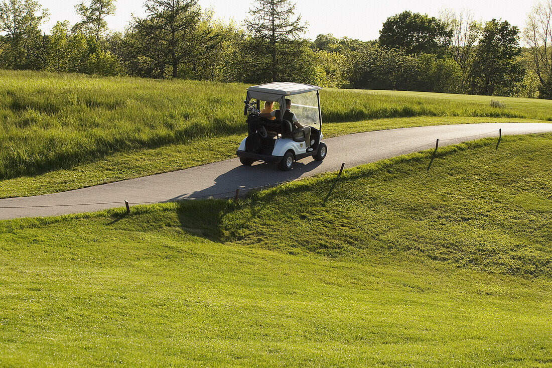 People in Golf Cart