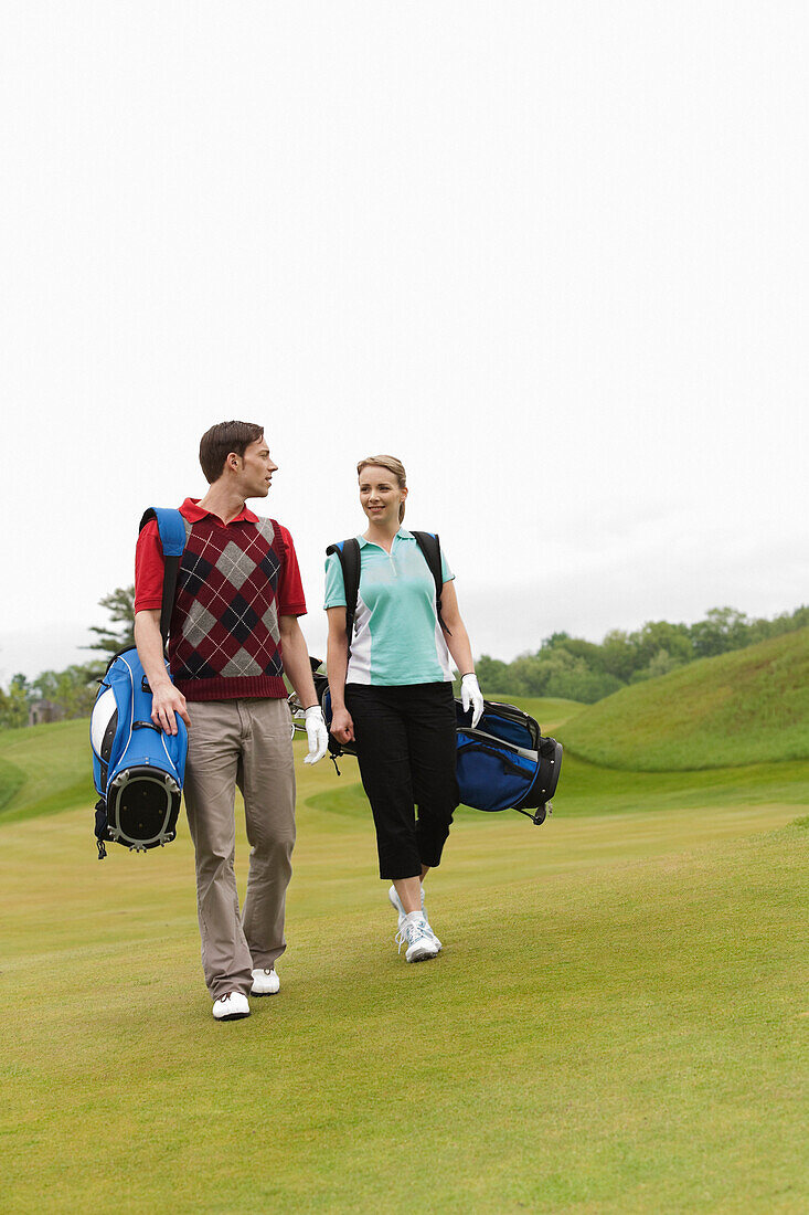 Couple Walking on Golf Course