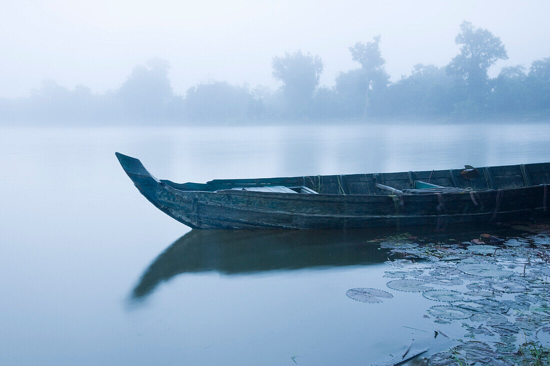 Canoe in Morning Mist at Sras Srang,Angkor,Cambodia