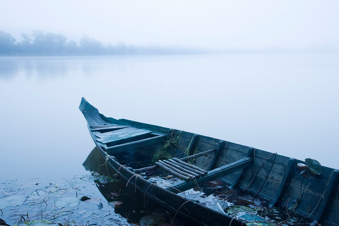 Canoe in Morning Mist at Sras Srang,Angkor,Cambodia