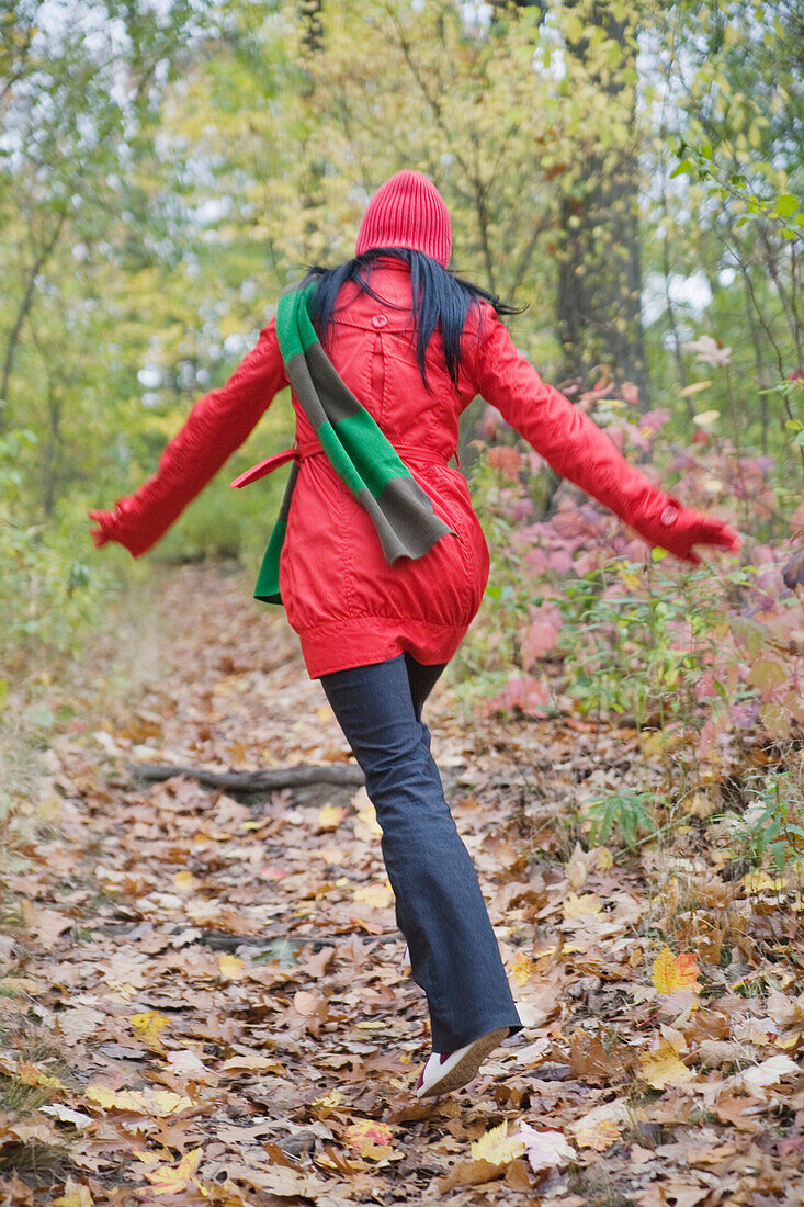 Woman Walking in Forest