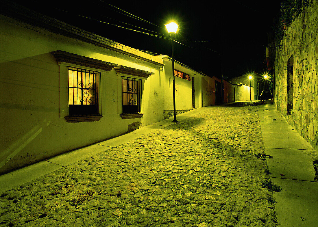 Buildings and Cobblestone Street At Night,Oaxace,Mexico