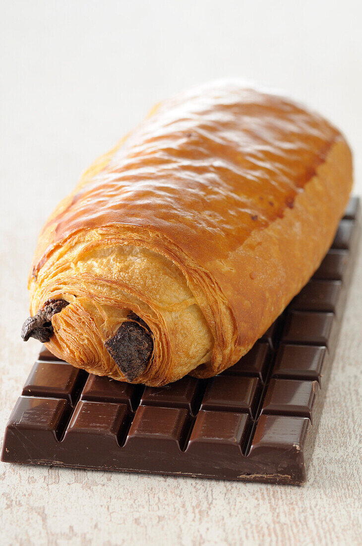 Close-up of Chocolate Croissant on top of Chocolate Bar,Studio Shot