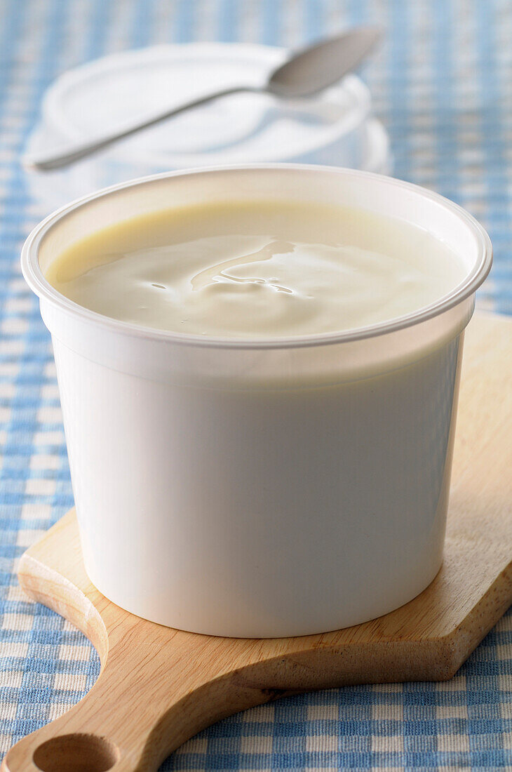 Close-up of Creme Fraiche on Cutting Board on Gingham Background,Studio Shot