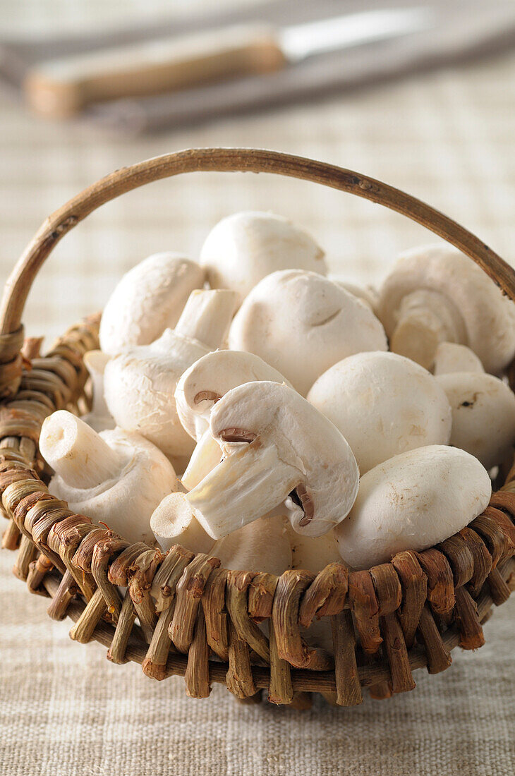 Close-up of Basket with Button Mushrooms