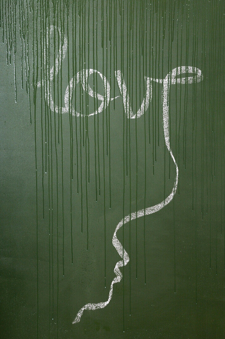 Love Written in Cursive on Wet Chalkboard