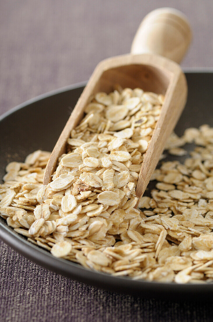 Close-up of Bowl of Oat Flakes with Scoop,Studio Shot