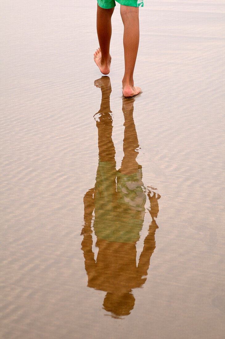 Boy's Legs Walking on Beach with Reflection,Rabat,Morocco