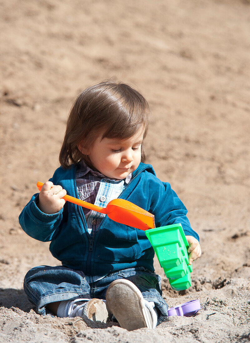 Little Boy Playing in Sand