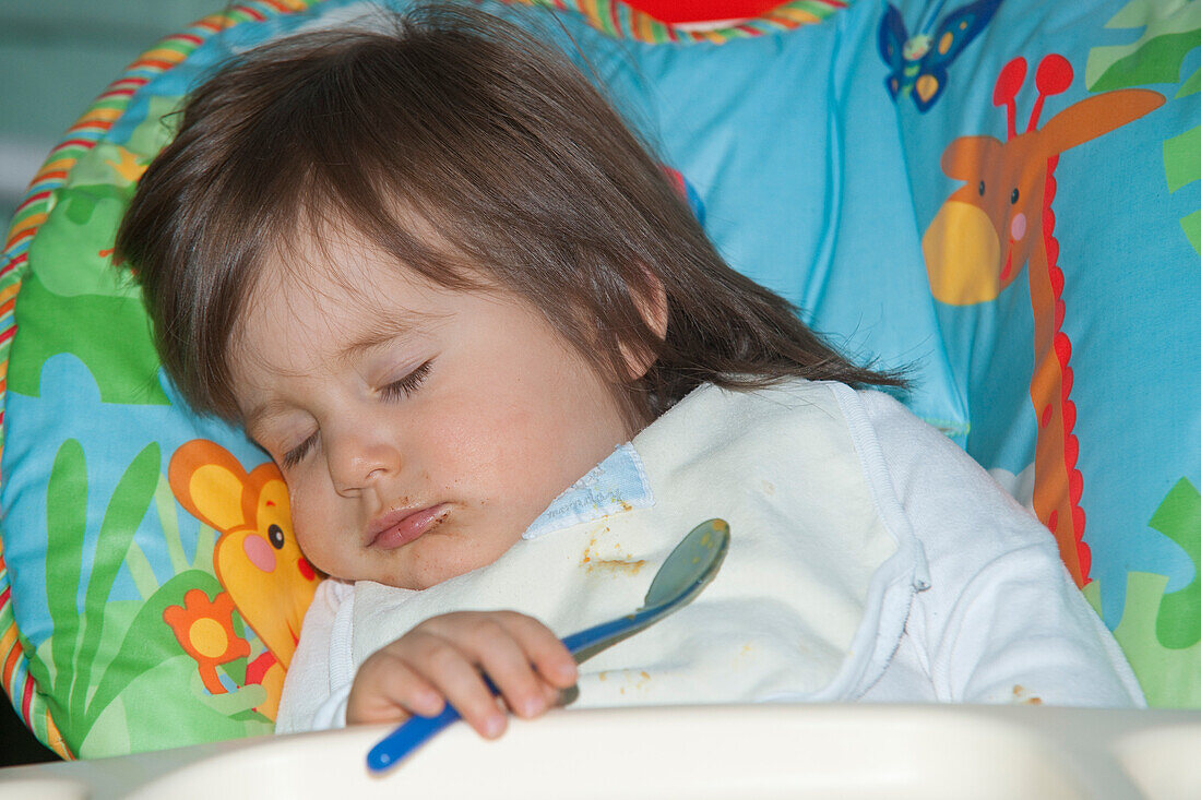 Baby Sleeping in High Chair