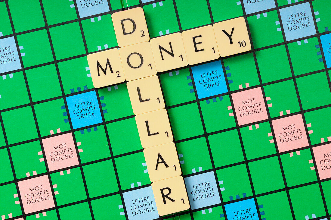 Money and Dollar spelled with Game Tiles