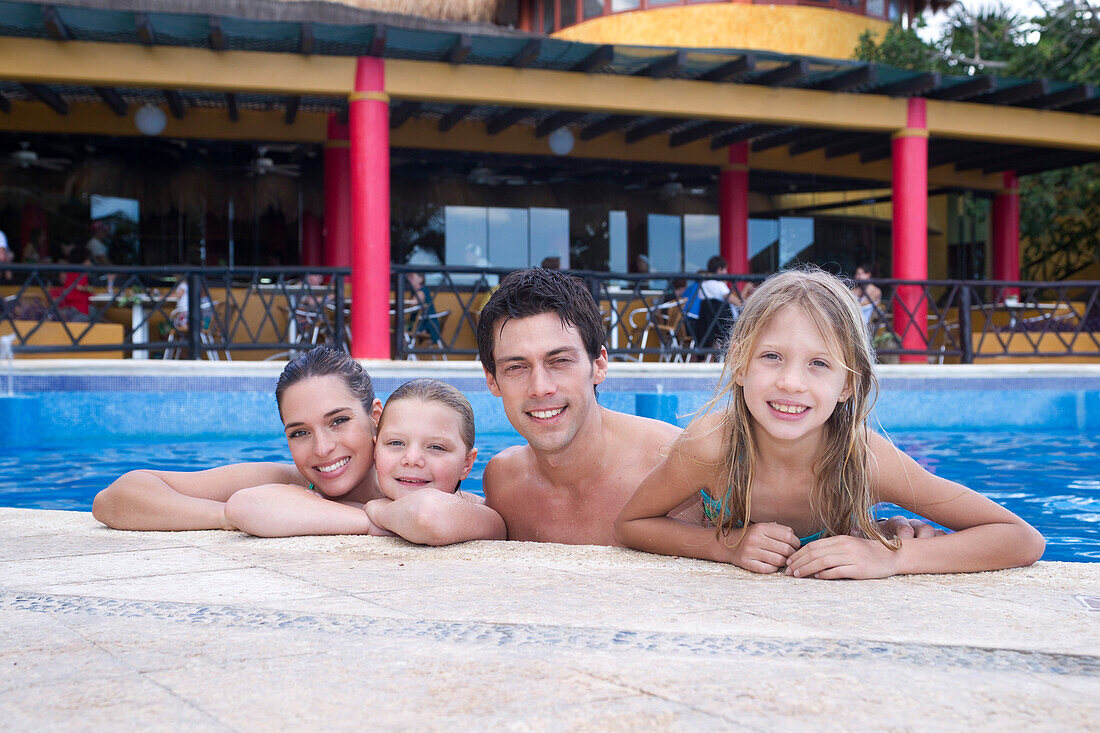 Family in Swimming Pool,Reef Playacar Resort and Spa,Playa del Carmen,Mexico