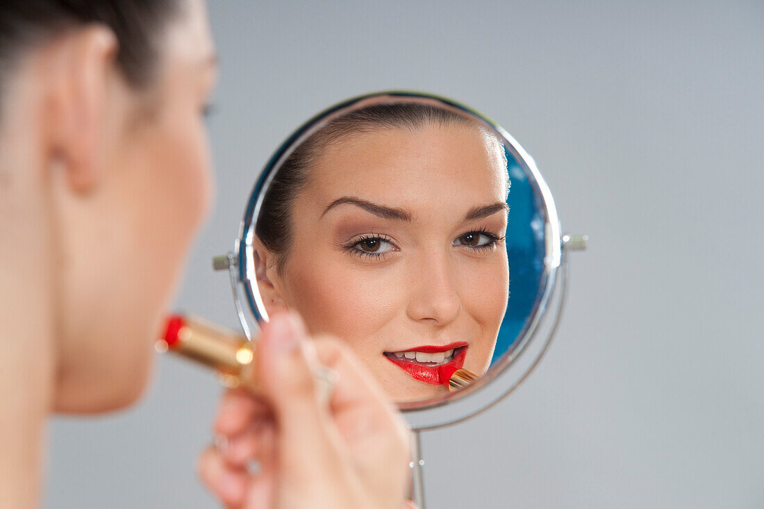 Woman Applying Lipstick