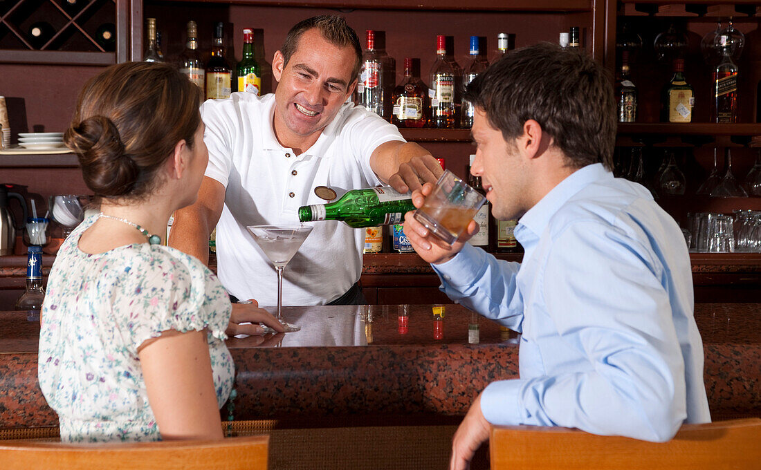 Couple having Drinks at Bar,Reef Playacar Resort and Spa,Playa del Carmen,Mexico