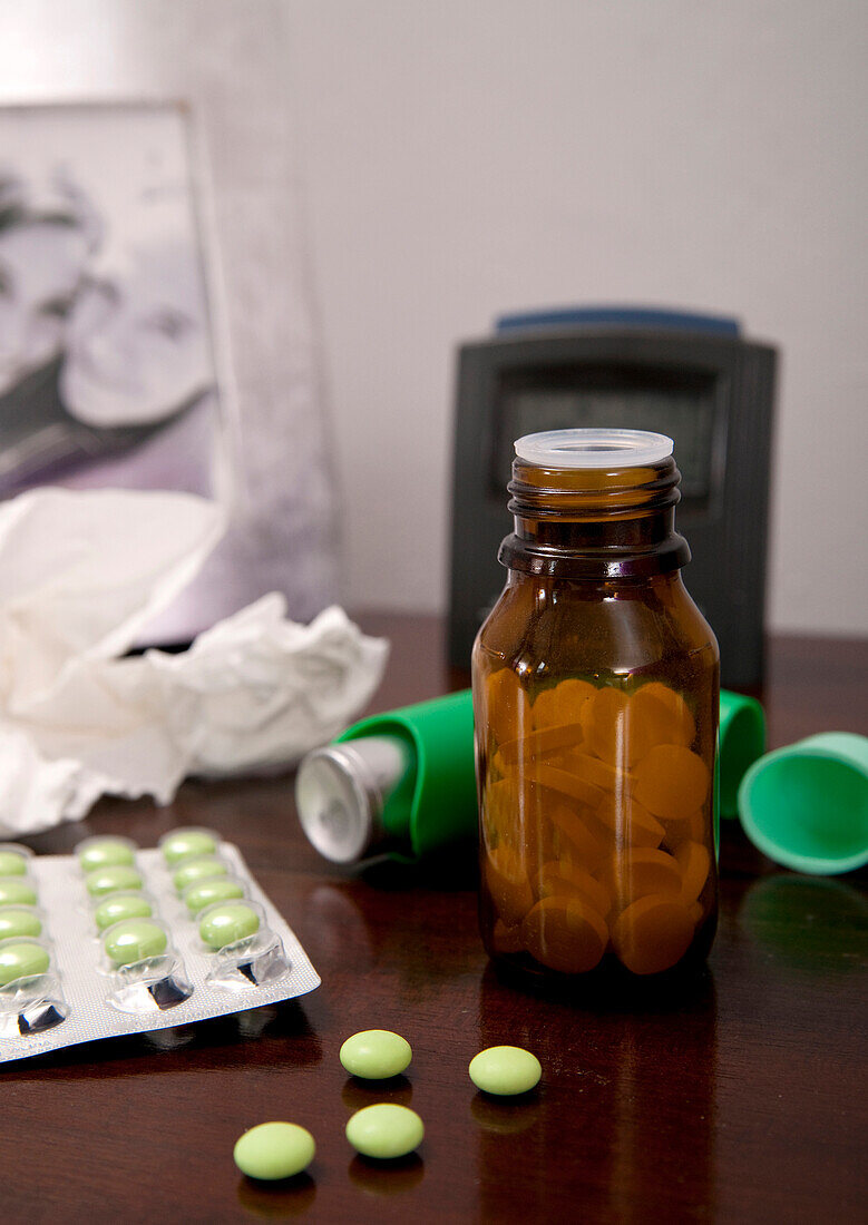 Variety of medications on bedside table,studio shot