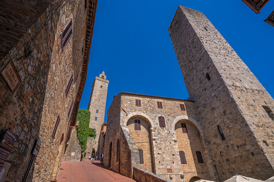 View of towers from street level in San Gimignano,San Gimignano,UNESCO World Heritage Site,Province of Siena,Tuscany,Italy,Europe