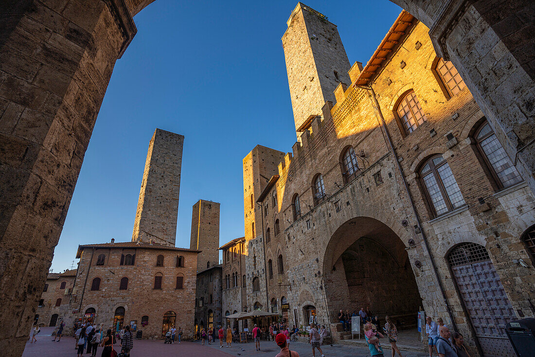 View of historic centre and towers in Piazza del Duomo,San Gimignano,UNESCO World Heritage Site,Province of Siena,Tuscany,Italy,Europe