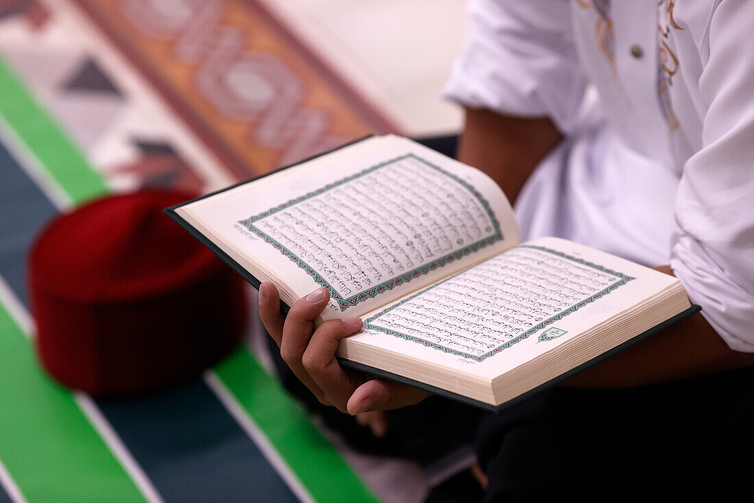 Muslim man reading a Quran,Ho Chi Minh City,Vietnam,Indochina,Southeast Asia,Asia