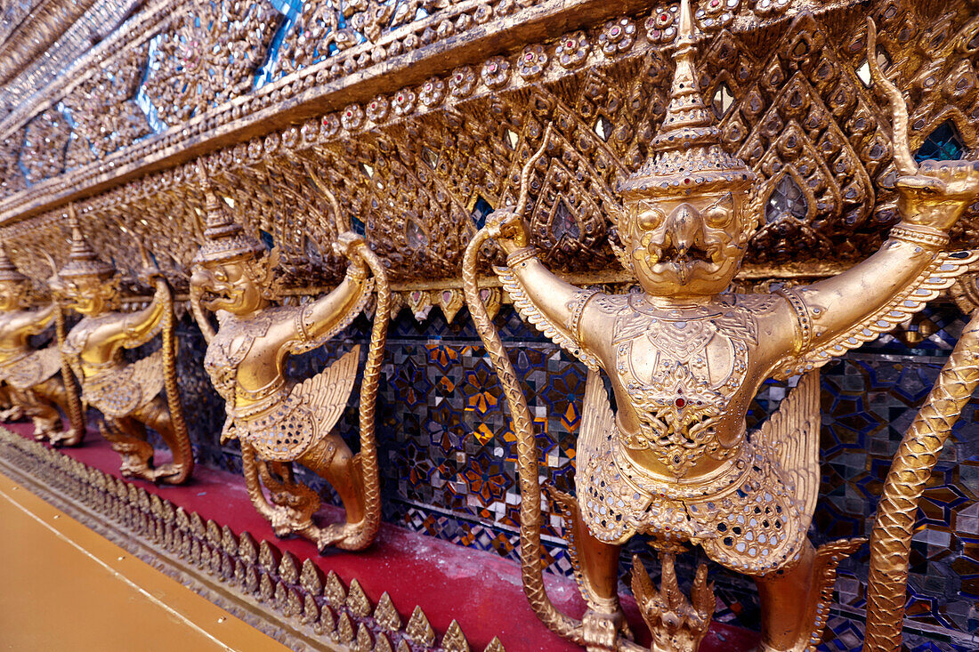 Golden sculptures of Garuda and Naga,Wat Phra Kaew (Temple of the Emerald Buddha),Bangkok,Thailand,Southeast Asia,Asia