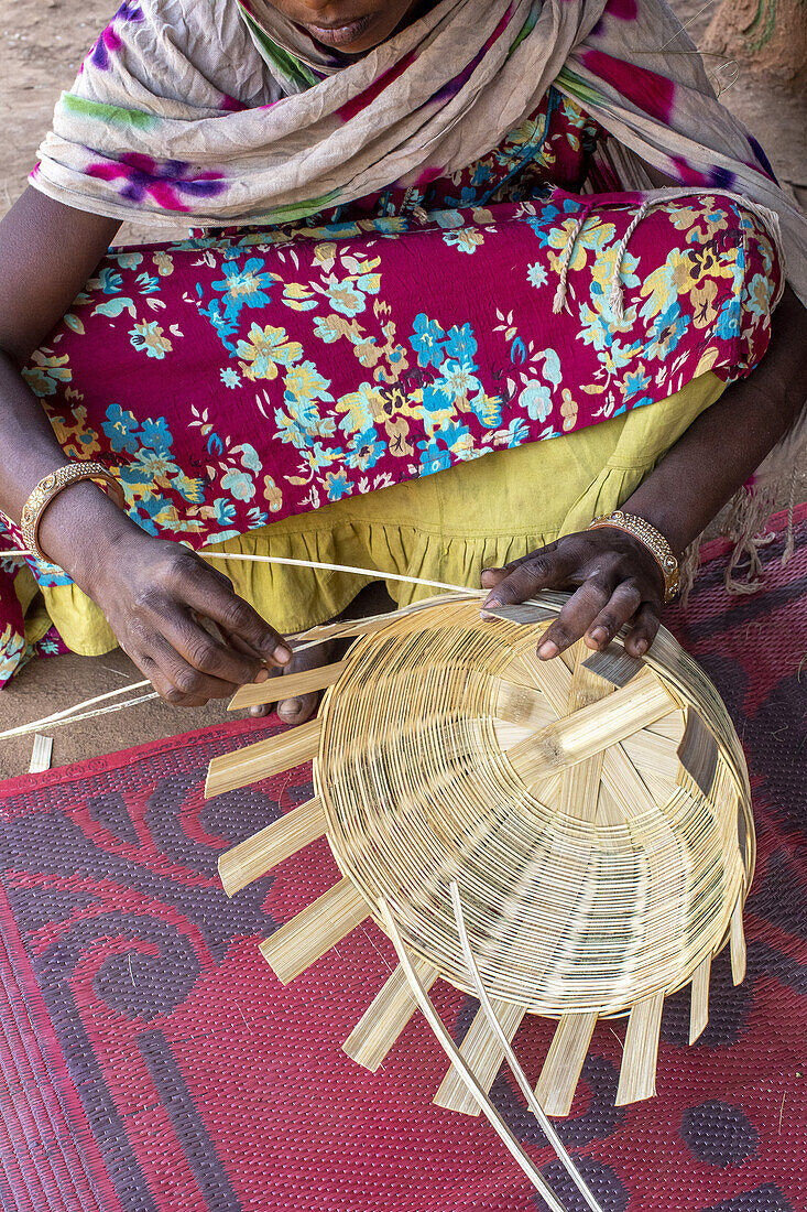 Adivasi woman making baskets in a village in Narmada district,Gujarat,India,Asia