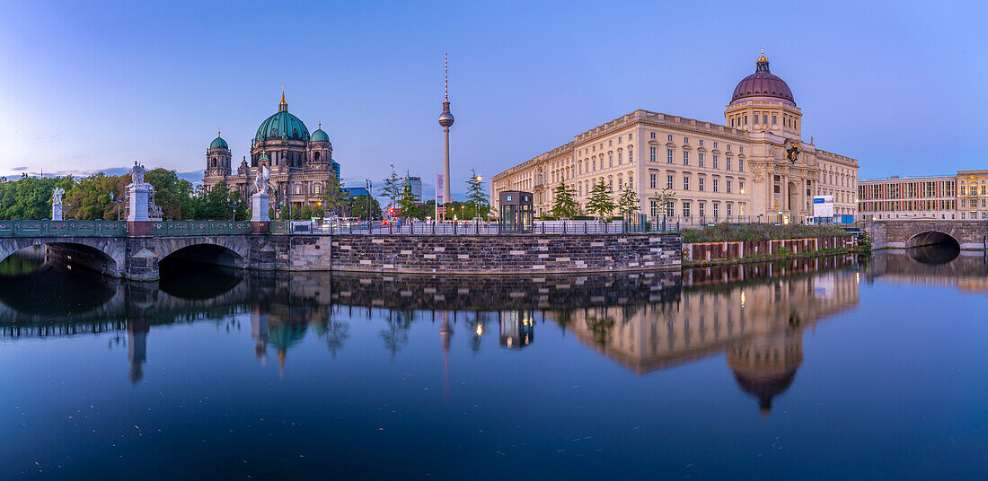 View of Berliner Dom,Berliner Fernsehturm and Humboldt Forum reflecting in River Spree at dusk,Berlin,Germany,Europe