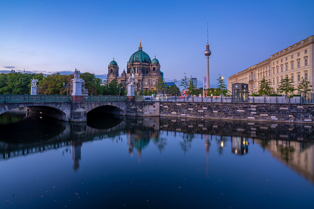 View of Berliner Dom,Berliner Fernsehturm reflecting in River Spree at dusk,Berlin,Germany,Europe