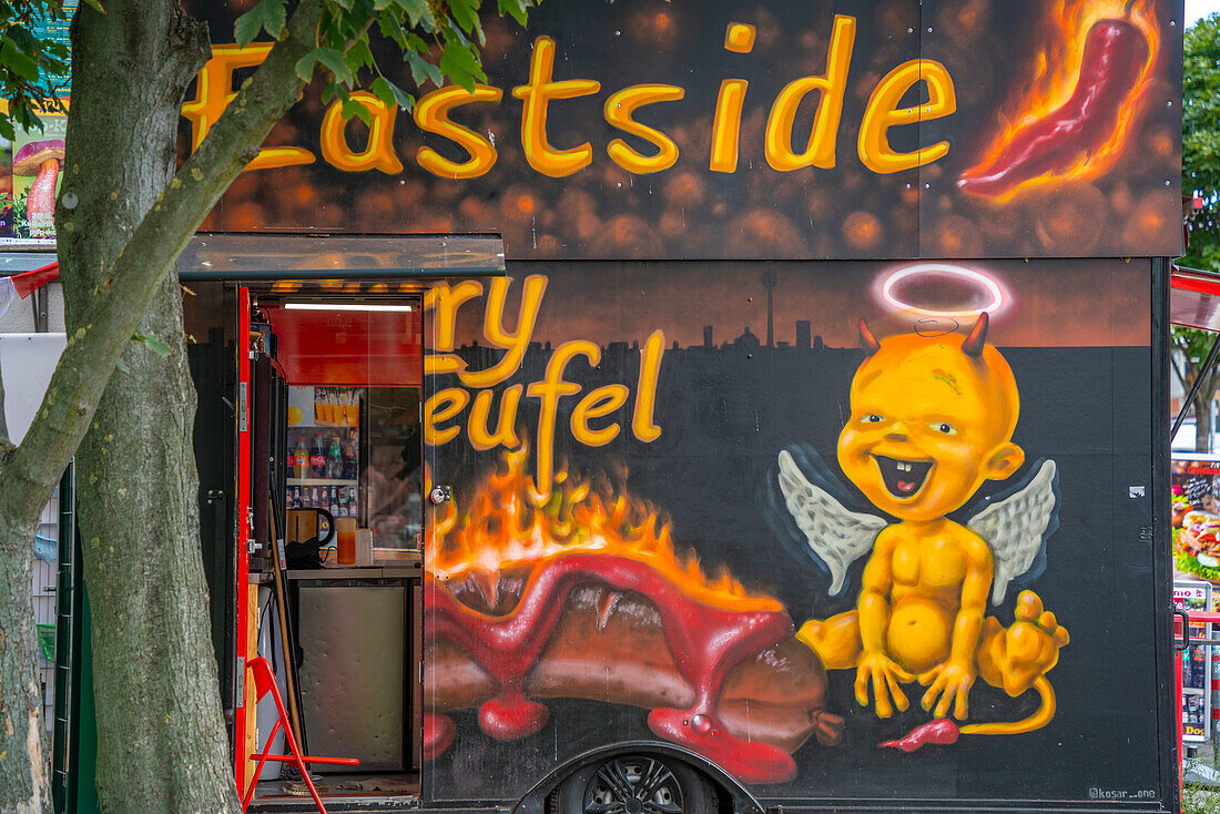 View of colourful fast food outlet near Eastside section of the former Berlin Wall along the Spree River,Berlin,Germany,Europe