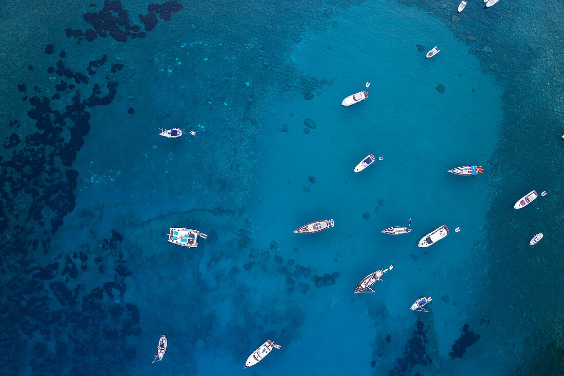 Aerial view of boats anchored in the crystal blue waters,Palmarola island,Tyrrhenian Sea,Ponza municipality,Pontine archipelago,Latina Province,Latium (Lazio),Italy,Europe