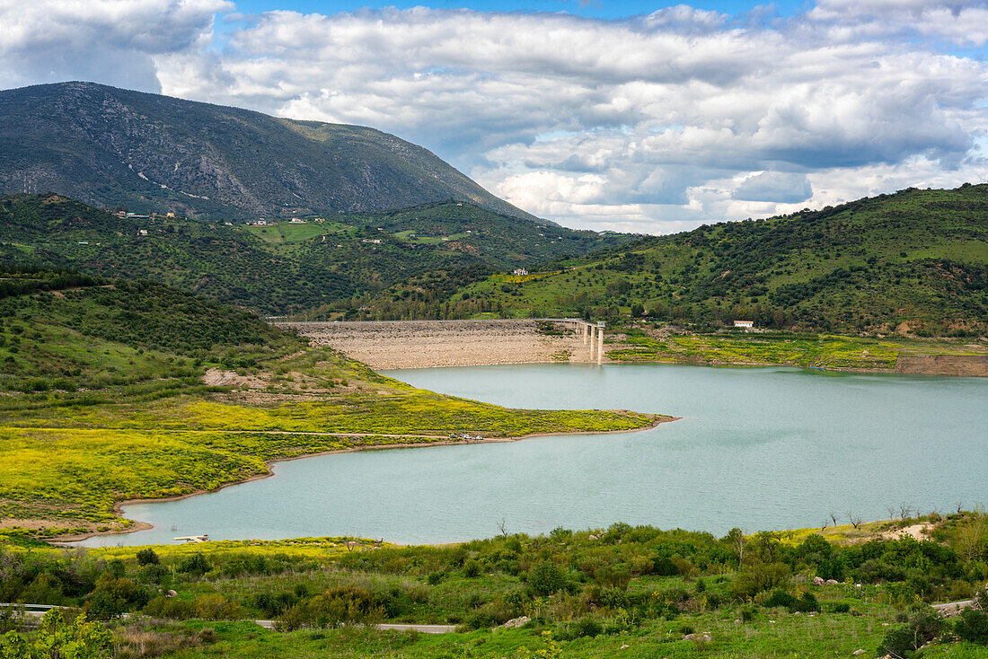 Zahara de la Sierra water reservoir dam with turquoise water and mountains in the background,Andalusia,Spain,Europe
