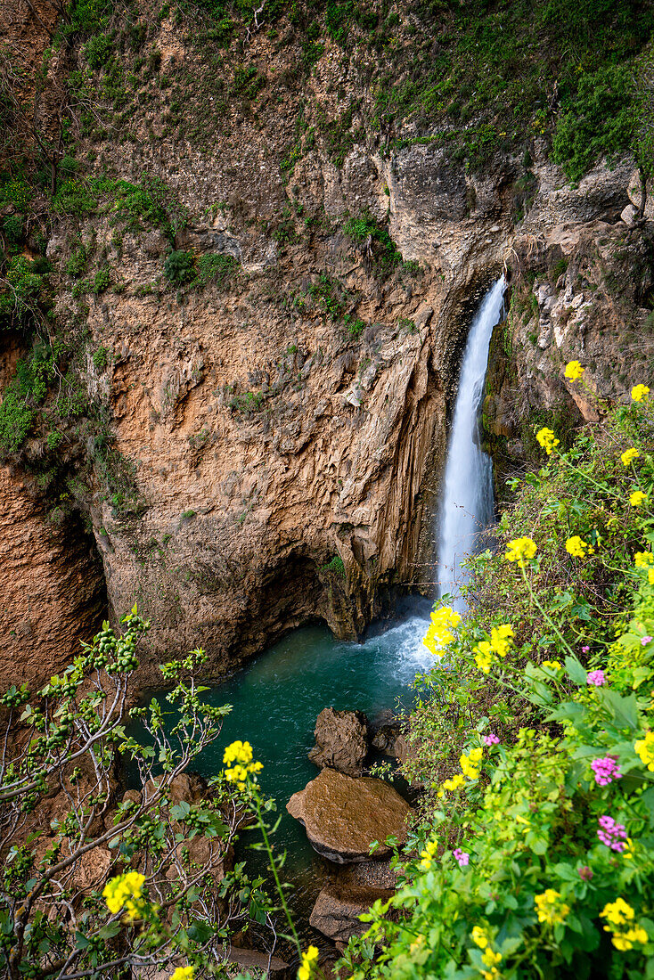 Waterfall near historic bridge of Ronda in Pueblos Blancos region,Andalusia,Spain,Europe